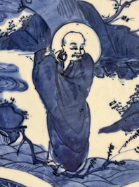 A Chinese blue and white 'kraak' dish with Damo in a landscape, Wanli