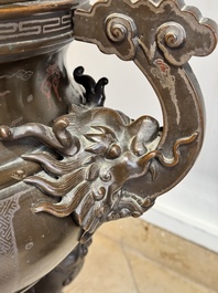A massive Vietnamese copper- and silver-inlaid 'Buddhist lion' censer and cover on stand, 19th C.