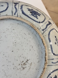 A Chinese blue and white 'kraak' dish with Damo in a landscape, Wanli