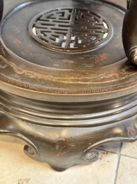 A massive Vietnamese copper- and silver-inlaid 'Buddhist lion' censer and cover on stand, 19th C.