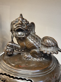 A massive Vietnamese copper- and silver-inlaid 'Buddhist lion' censer and cover on stand, 19th C.