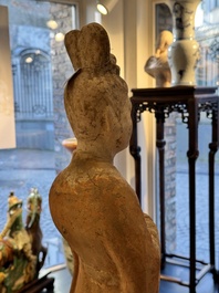 A large Chinese painted pottery figure of a civil official, Tang