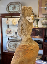 A large Chinese painted pottery figure of a civil official, Tang