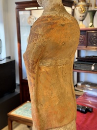 A large Chinese painted pottery figure of a civil official, Tang
