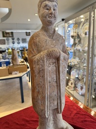 A large Chinese painted pottery figure of a civil official, Tang
