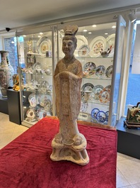 A large Chinese painted pottery figure of a civil official, Tang