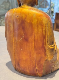 A Chinese gilt-lacquered wooden sculpture of Buddha, Ming
