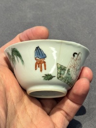 A Chinese famille verte 'erotic' cup and saucer, lingzhi mark, Kangxi
