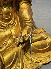 A Chinese gilt-lacquered wooden sculpture of Buddha, Ming