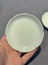 A pair of Chinese eggshell white-glazed cups and saucers, and two famille rose cups, 18th C.
