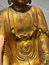 A Chinese gilt-lacquered wooden sculpture of Buddha, Ming