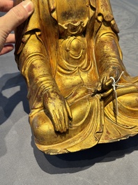 A Chinese gilt-lacquered wooden sculpture of Buddha, Ming