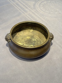 A Chinese bronze censer with lion-form handles, 大明宣德五年監造工部官監吳邦佐造 mark, 18th C.