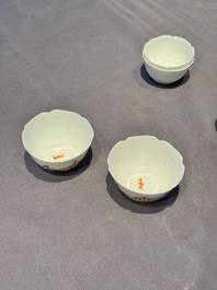 A pair of Chinese eggshell white-glazed cups and saucers, and two famille rose cups, 18th C.