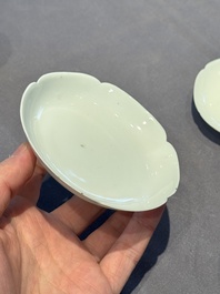 A pair of Chinese eggshell white-glazed cups and saucers, and two famille rose cups, 18th C.