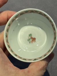 A Chinese famille verte 'erotic' cup and saucer, lingzhi mark, Kangxi