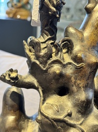 A rare Chinese bronze group depicting two immortals and various animals in a mountainous landscape, Ming