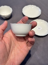 A pair of Chinese eggshell white-glazed cups and saucers, and two famille rose cups, 18th C.