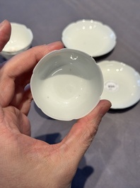A pair of Chinese eggshell white-glazed cups and saucers, and two famille rose cups, 18th C.