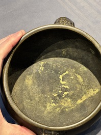 A Chinese bronze censer with lion-form handles, 大明宣德五年監造工部官監吳邦佐造 mark, 18th C.