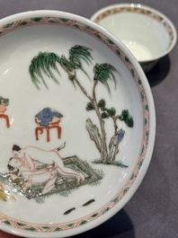 A Chinese famille verte 'erotic' cup and saucer, lingzhi mark, Kangxi