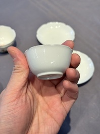 A pair of Chinese eggshell white-glazed cups and saucers, and two famille rose cups, 18th C.