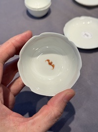 A pair of Chinese eggshell white-glazed cups and saucers, and two famille rose cups, 18th C.