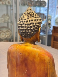 A Chinese gilt-lacquered wooden sculpture of Buddha, Ming