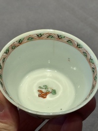 A Chinese famille verte 'erotic' cup and saucer, lingzhi mark, Kangxi