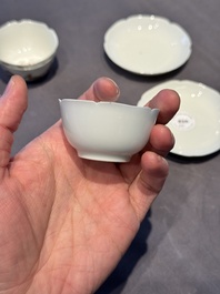 A pair of Chinese eggshell white-glazed cups and saucers, and two famille rose cups, 18th C.