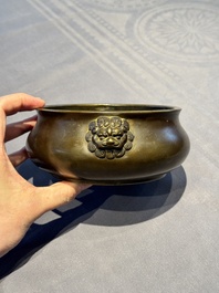 A Chinese bronze censer with lion-form handles, 大明宣德五年監造工部官監吳邦佐造 mark, 18th C.