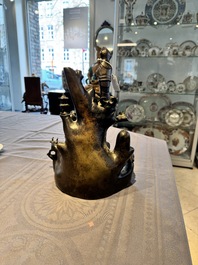 A rare Chinese bronze group depicting two immortals and various animals in a mountainous landscape, Ming