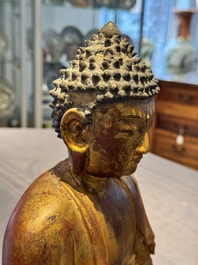 A Chinese gilt-lacquered wooden sculpture of Buddha, Ming