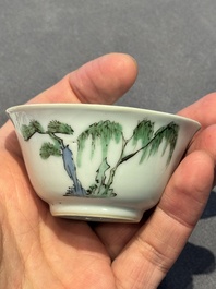 A Chinese famille verte 'erotic' cup and saucer, lingzhi mark, Kangxi