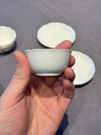 A pair of Chinese eggshell white-glazed cups and saucers, and two famille rose cups, 18th C.
