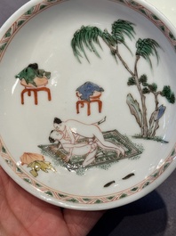 A Chinese famille verte 'erotic' cup and saucer, lingzhi mark, Kangxi