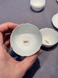 A pair of Chinese eggshell white-glazed cups and saucers, and two famille rose cups, 18th C.