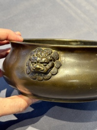 A Chinese bronze censer with lion-form handles, 大明宣德五年監造工部官監吳邦佐造 mark, 18th C.