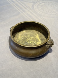 A Chinese bronze censer with lion-form handles, 大明宣德五年監造工部官監吳邦佐造 mark, 18th C.