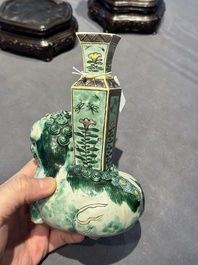 A pair of Chinese verte biscuit vases resting on Buddhist lions, Kangxi