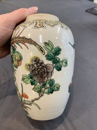 A pair of Chinese famille verte 'pheasant among flowering branches' vases and covers, 19th C.