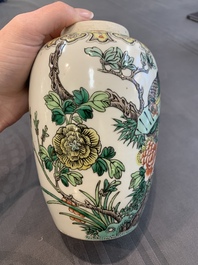A pair of Chinese famille verte 'pheasant among flowering branches' vases and covers, 19th C.