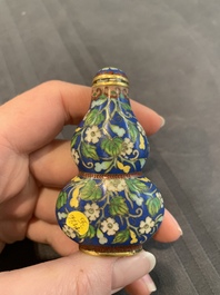 A collection of ten Chinese Canton enamel and porcelain snuff bottles, Qianlong mark, 19/20th C.