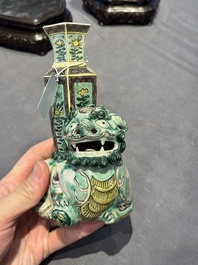 A pair of Chinese verte biscuit vases resting on Buddhist lions, Kangxi