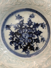 A Chinese blue and white celadon-ground plate with floral design, Ming