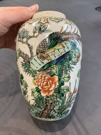A pair of Chinese famille verte 'pheasant among flowering branches' vases and covers, 19th C.