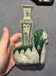 A pair of Chinese verte biscuit vases resting on Buddhist lions, Kangxi