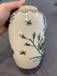 A pair of Chinese famille verte 'pheasant among flowering branches' vases and covers, 19th C.