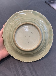 A Chinese blue and white celadon-ground plate with floral design, Ming