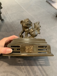 A large Vietnamese copper- and silver-inlaid rectangular 'Buddhist lion' censer and cover on stand, 19th C.